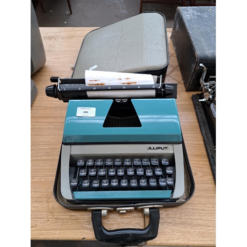 686 - A cased Lilliput portable typewriter