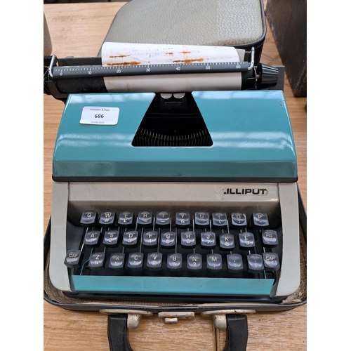 686 - A cased Lilliput portable typewriter