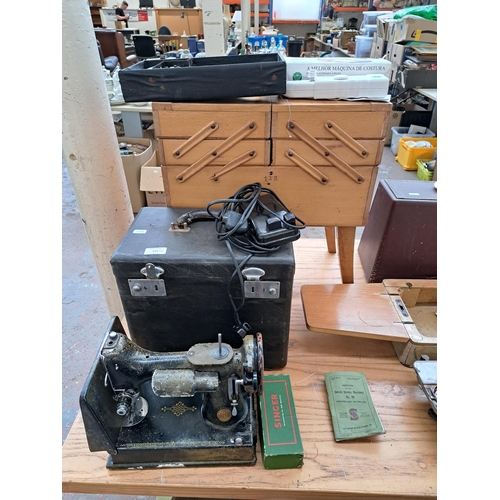 694 - Four items, one cased Singer featherweight portable electric sewing machine for spares or repair, on... 