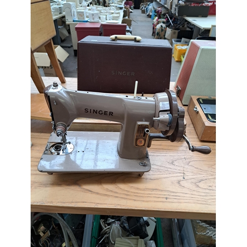 694 - Four items, one cased Singer featherweight portable electric sewing machine for spares or repair, on... 