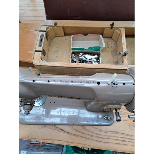 694 - Four items, one cased Singer featherweight portable electric sewing machine for spares or repair, on... 