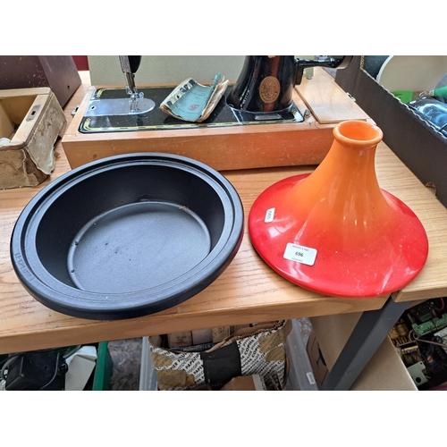 696 - A Le Creuset enamelled cast iron and stoneware tagine