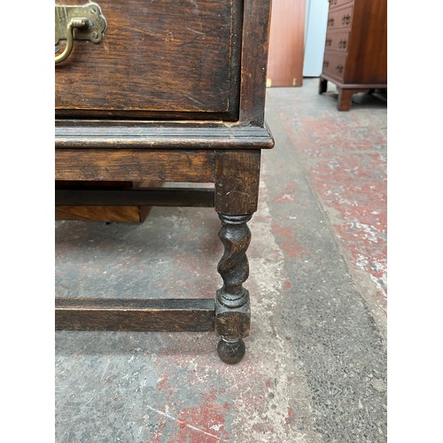 103A - An early 20th century oak bureau bookcase on barley twist supports - approx. 98cm high x 87cm wide x... 