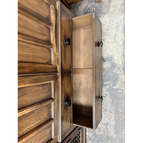 204 - An early 20th century mahogany bedside cabinet with later added glass top