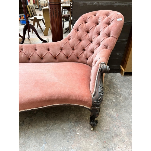 1 - A Victorian rosewood and pink fabric upholstered chaise longue