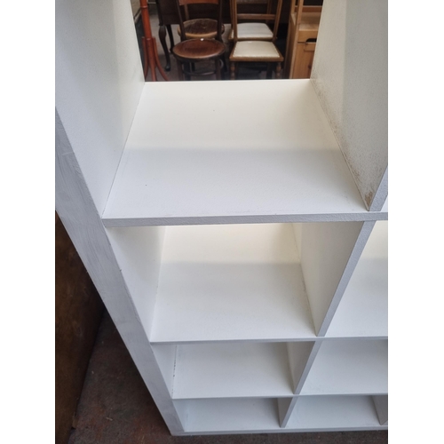 100 - An IKEA white painted eight section cube shelving unit