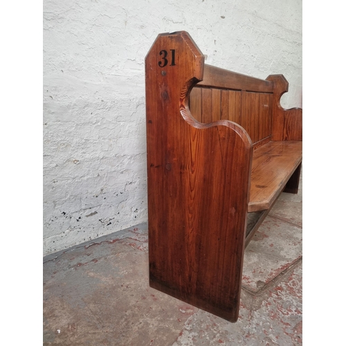 101 - A late 19th century pitch pine church pew - approx. 93cm high x 153cm wide x 41cm deep