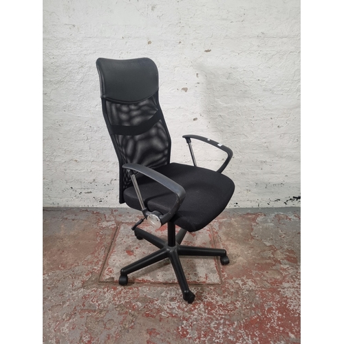 103 - A modern black plastic and mesh fabric swivel office desk chair