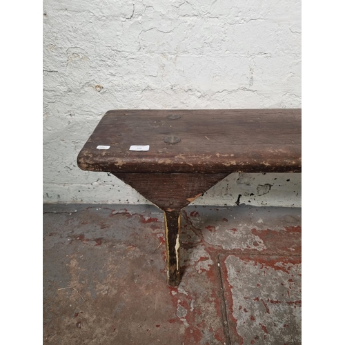 109 - An early 20th century pine bench - approx. 42cm high x 27cm wide 143cm long