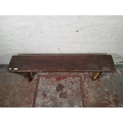 109 - An early 20th century pine bench - approx. 42cm high x 27cm wide 143cm long