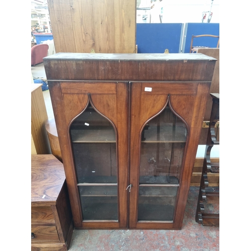 113 - A Victorian walnut wall mountable two door bookcase - approx. 141cm high x 92cm wide x 27cm deep