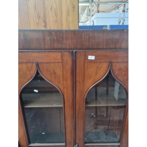 113 - A Victorian walnut wall mountable two door bookcase - approx. 141cm high x 92cm wide x 27cm deep