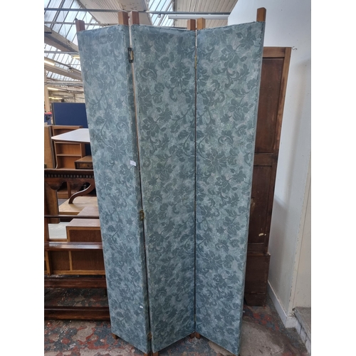 115 - A mid 20th century floral upholstered and pine three section folding dressing screen - approx. 200cm... 