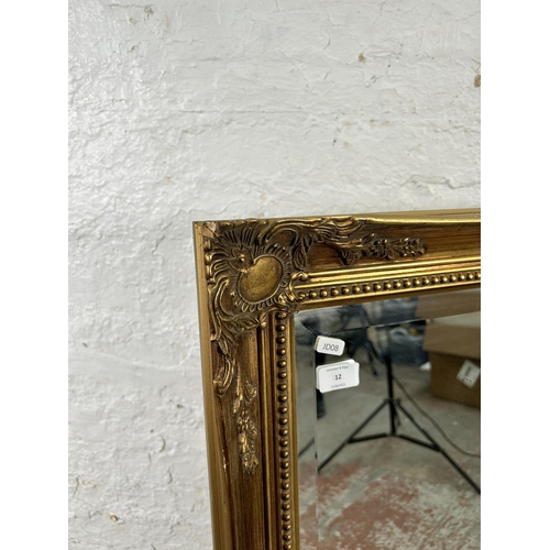 12 - A gilt framed bevelled edge wall mirror 
- approx. 90cm high x 115cm wide