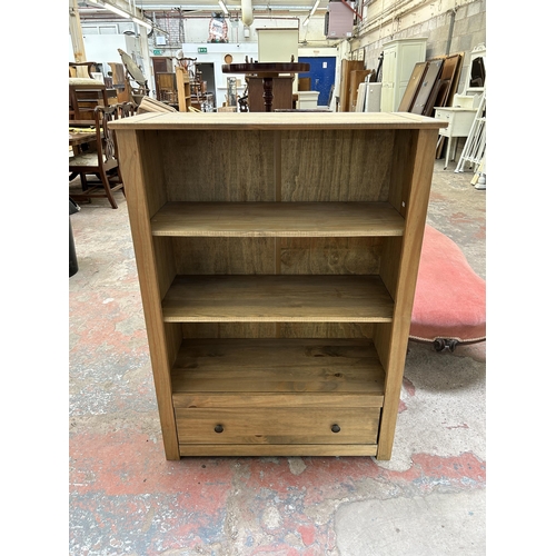 24 - A Mexican pine three tier bookcase