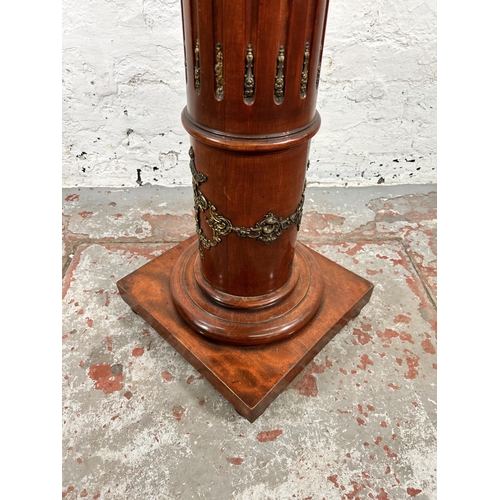 26 - A French Empire style mahogany and gilt metal jardinière stand - approx. 107cm high