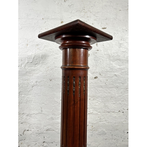 26 - A French Empire style mahogany and gilt metal jardinière stand - approx. 107cm high