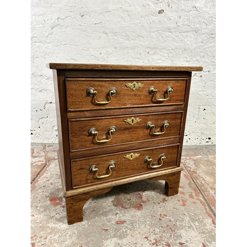 28 - A Georgian style mahogany miniature chest of three drawers - approx. 51cm high x 48cm wide x 37cm de... 