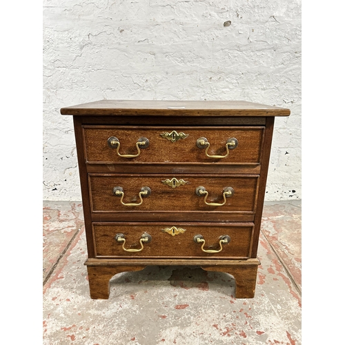 28 - A Georgian style mahogany miniature chest of three drawers - approx. 51cm high x 48cm wide x 37cm de... 