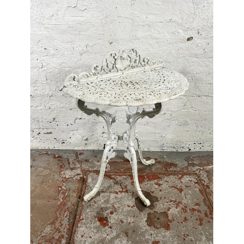 38 - A Victorian style white painted cast metal half moon console table