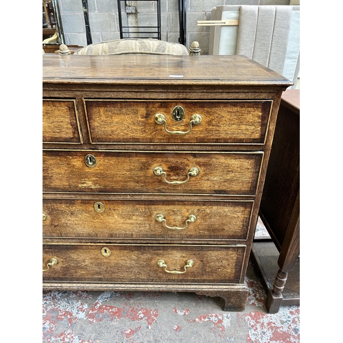 41 - A George III oak and mahogany crossbanded chest of two short over three long drawers with bracket su... 