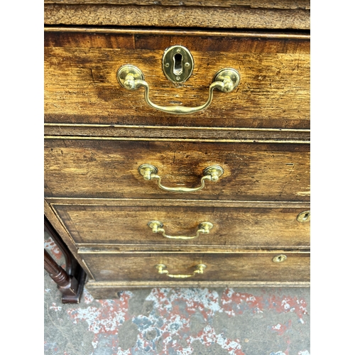 41 - A George III oak and mahogany crossbanded chest of two short over three long drawers with bracket su... 