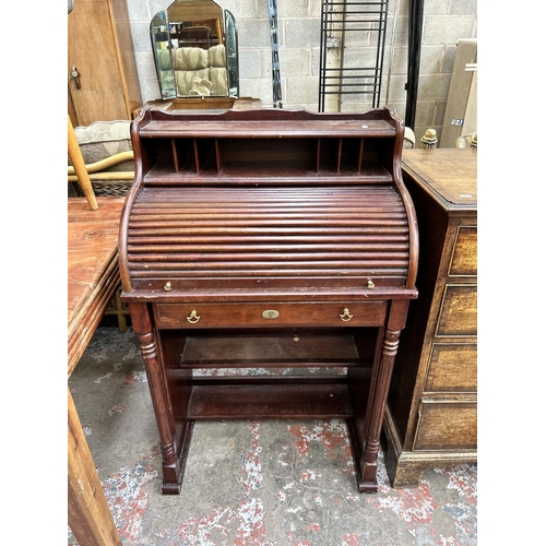 43 - A mahogany roll top bureau