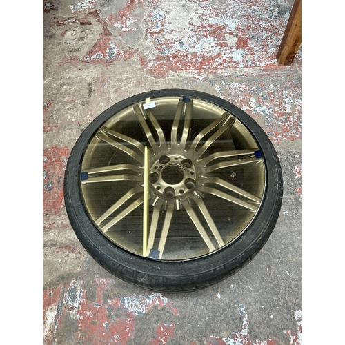 52 - A BMW M Series alloy wheel with later added smoked glass top