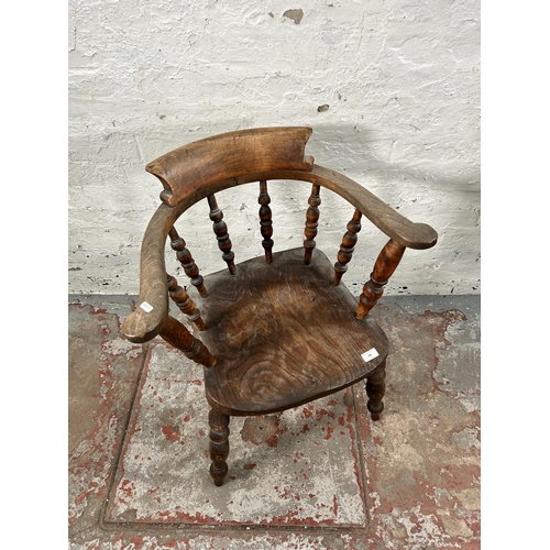 186 - A Victorian elm smoker's bow chair