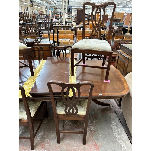 60 - A Bevan Funnell Reprodux mahogany extending dining table and six chairs