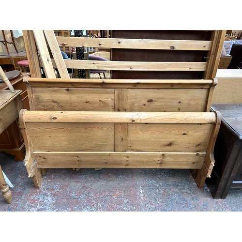 189 - A pine double sleigh bedframe