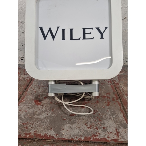 68 - A Wiley illuminating double sided advertising sign - approx. 70cm high x 60cm wide x 24cm deep