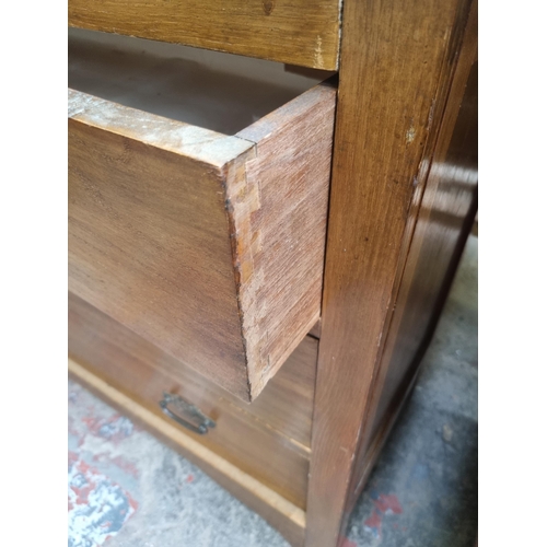 69 - An Edwardian oak chest of three drawers