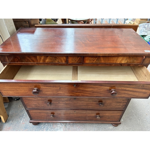 200 - An early 19th century mahogany chest of drawers with two secret drawers and turned supports - approx... 