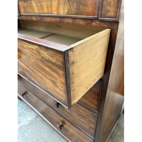 200 - An early 19th century mahogany chest of drawers with two secret drawers and turned supports - approx... 