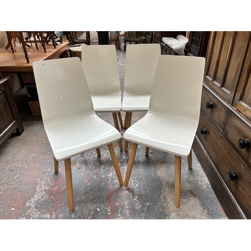 203 - Four modern white painted and beech dining chairs