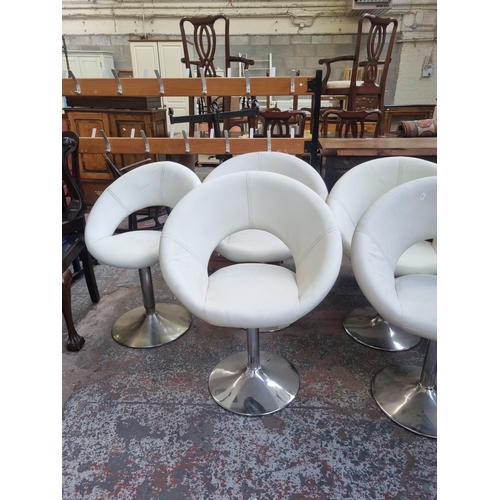 92 - A set of six modern white leatherette and chrome plated kitchen bar stools together with one further... 