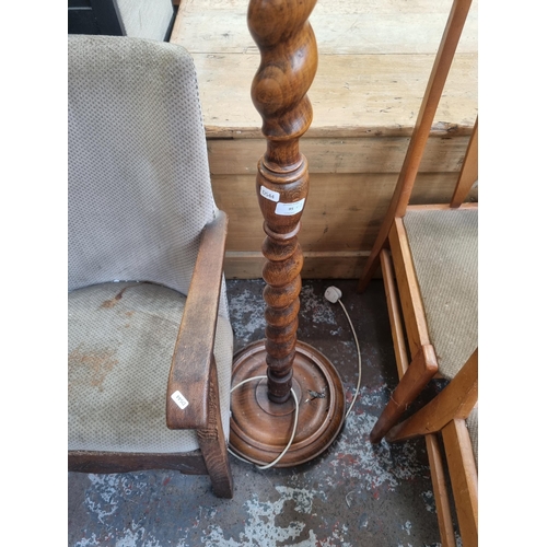 95 - Two items, one beech barley twist standard lamp - approx. 150cm high and one carved oak and brown fa... 