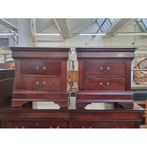 97 - A pair of Georgian style mahogany bedside chests of two drawers