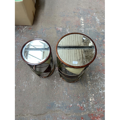 221 - Two contemporary metal and bevelled mirror glass cylindrical side tables - largest approx. 60cm high... 