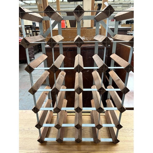 222 - A wood and metal twenty four section bottle rack