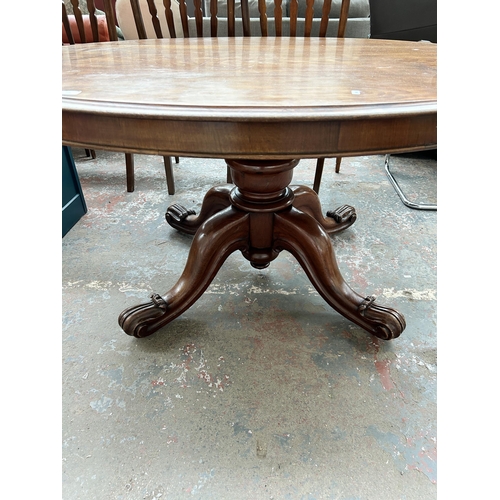 224 - A Victorian walnut oval tilt top breakfast table - approx. 75cm high x 115cm wide x 150cm long