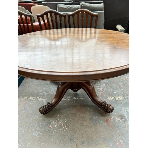 224 - A Victorian walnut oval tilt top breakfast table - approx. 75cm high x 115cm wide x 150cm long