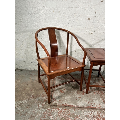 227 - A pair of Chinese hardwood horseshoe back chairs with side table