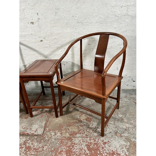 227 - A pair of Chinese hardwood horseshoe back chairs with side table