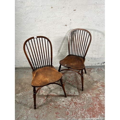 229 - A pair of 19th century style elm Windsor dining chairs