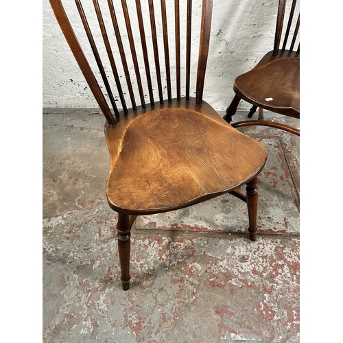 229 - A pair of 19th century style elm Windsor dining chairs