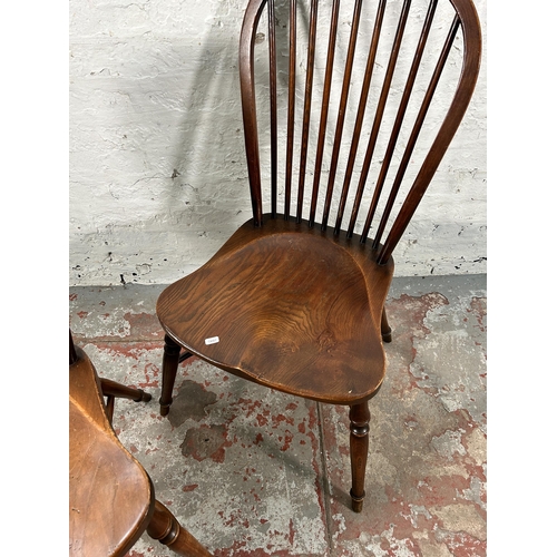 229 - A pair of 19th century style elm Windsor dining chairs