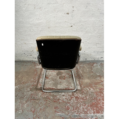 231 - A mid 20th century Martin Stoll style cream leather and chrome plated cantilever armchair