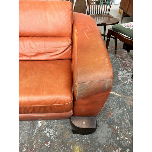 233 - An Italian Marinelli orange leather sofa - approx. 79cm high x 214cm wide x 98cm deep